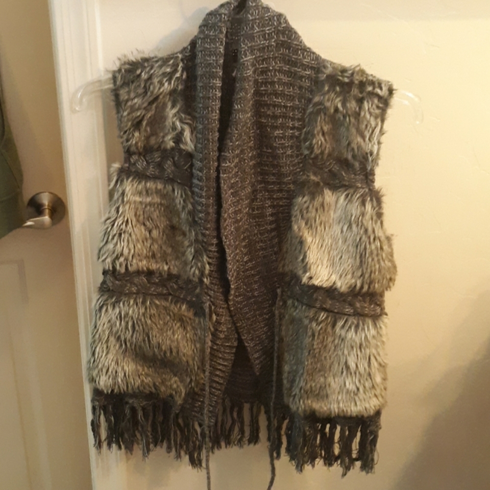 Vest medium but can fit L.